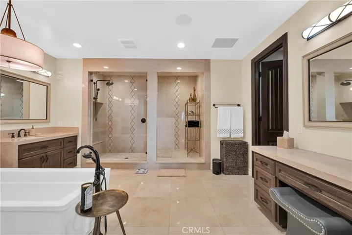 The spa shower spans nearly the full width of the room