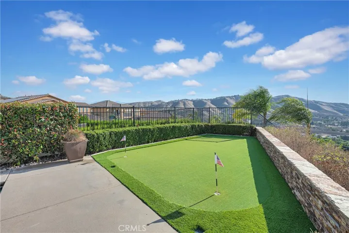 Private putting green at the view edge of the property