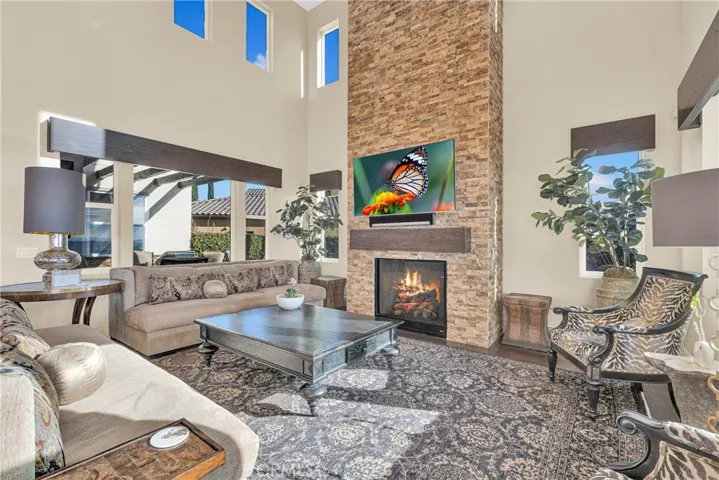 The stacked stone fireplace rises the full two stories