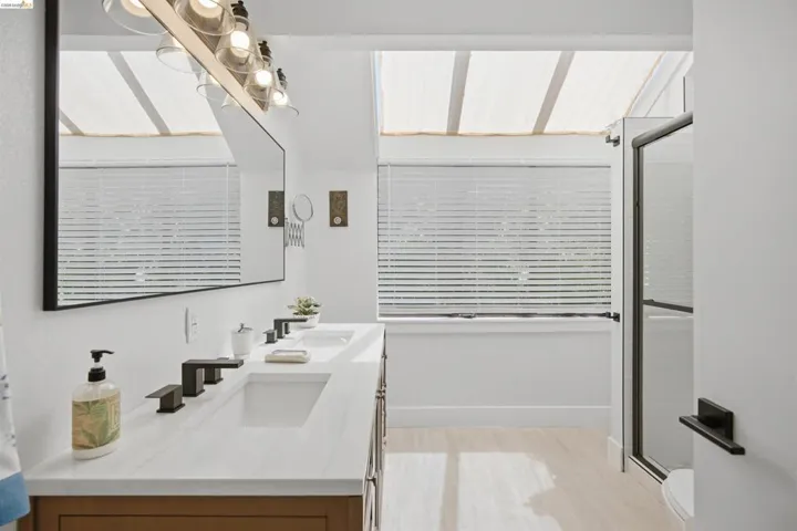 Double vanity with white countertop and integrated sinks