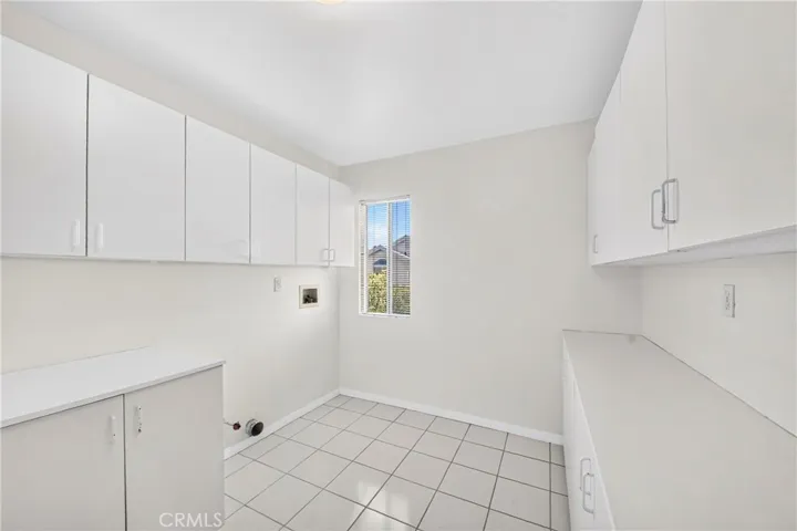 Large Laundry Room with lots of cabinets for storage