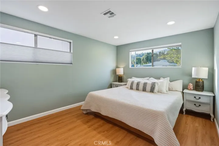 Primary bedroom with custom top-down/bottom-up Budget Blinds