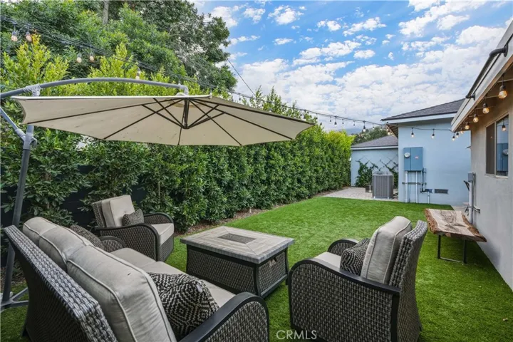 Backyard retreat with tall privacy ficus edges