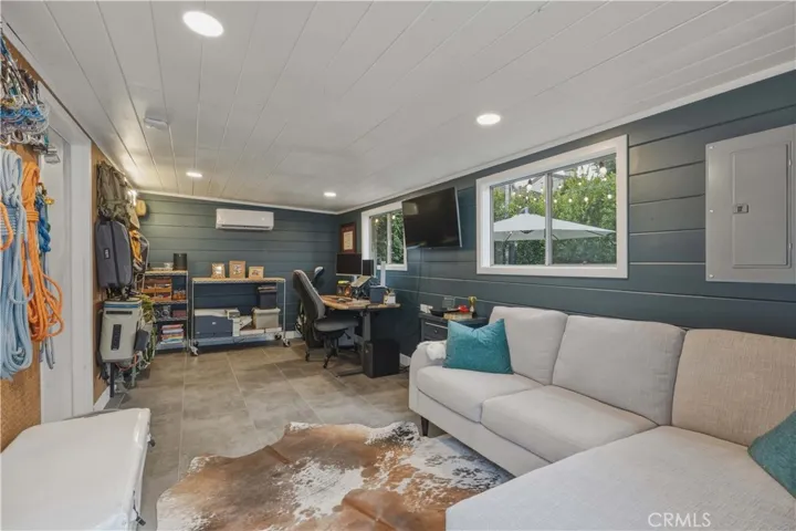 200 sq ft detached office, insulated with a mini-split AC, wrapped in tongue-and-groove shiplap