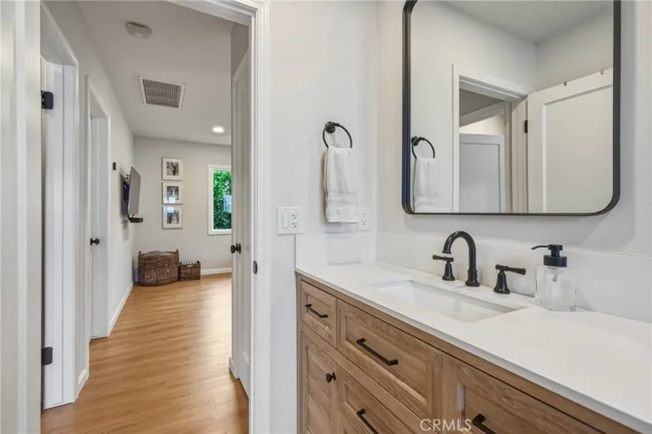 Bathroom with new oversized vanity and modern black fixtures
