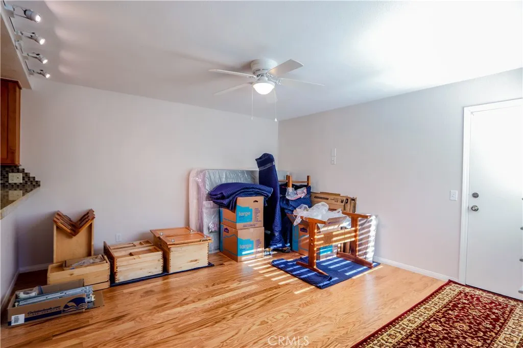 Family room off the kitchen with direct access to the garage.  New hardwood floors