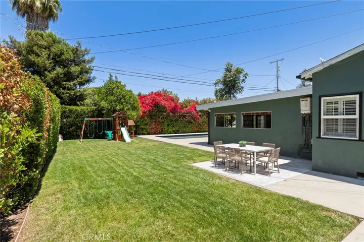 Overlooking backyard toward the pool showing dining area and much more.