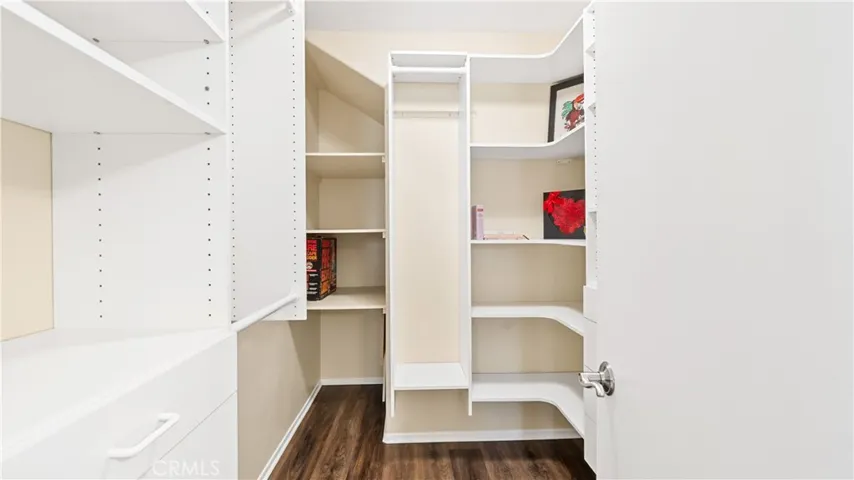 Walk In Closet With Custom Organizers