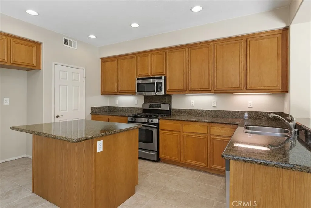 Kitchen has Granite Counter Tops
