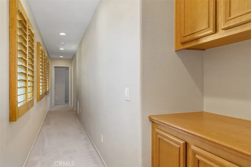 Hallway to other bedrooms wood shutters