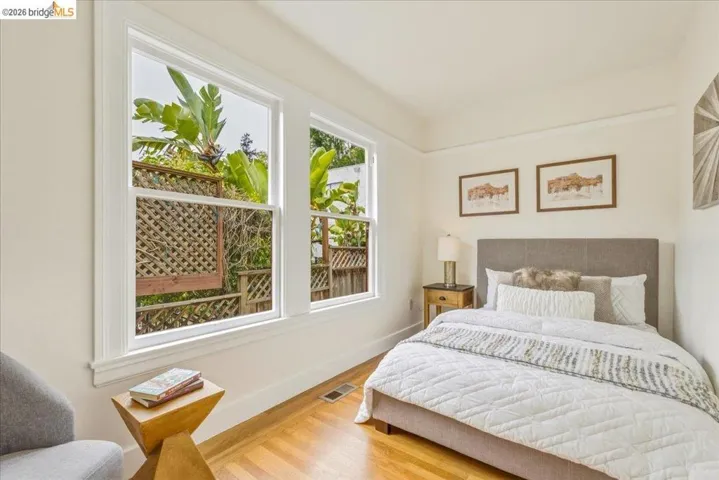 Bright room with wood-finish flooring and white trim