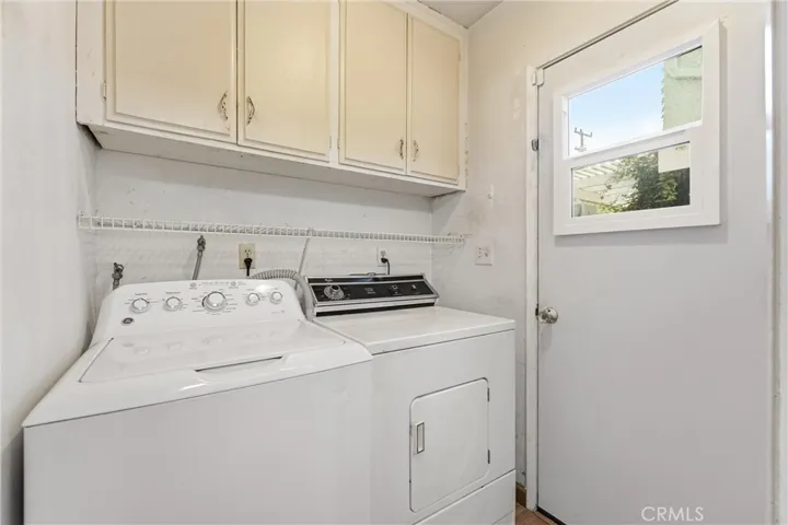Laundry Room off kitchen, door to side yard
