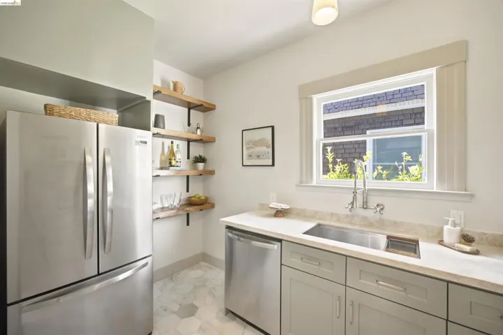 Kitchenette featuring stainless steel appliances including a French door refrigerator and dishwasher