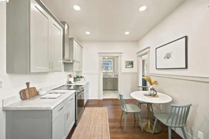 Modern kitchen with light grey shaker cabinetry and light countertops