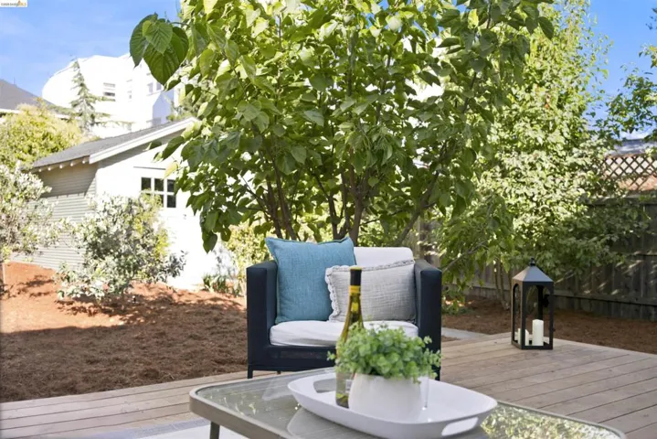 Expansive wood-finish decking with ample space for outdoor seating