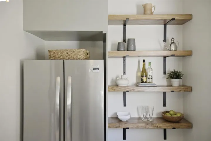 Open shelving with wood-finish planks and matte black brackets