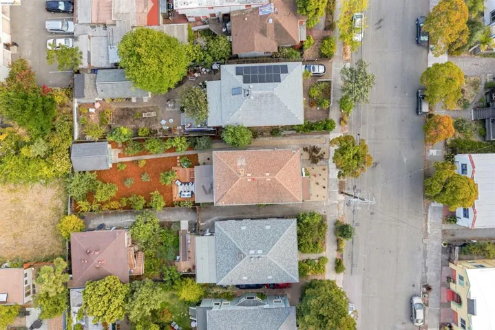 Aerial perspective showcasing a residential street with diverse property layouts