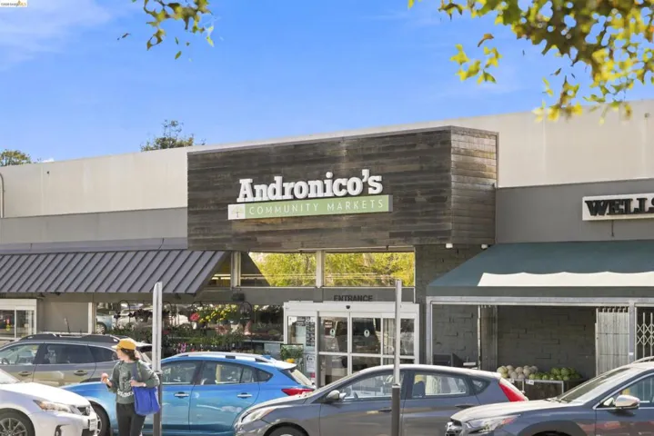 Retail building exterior featuring prominent signage for Andronico's Community Markets