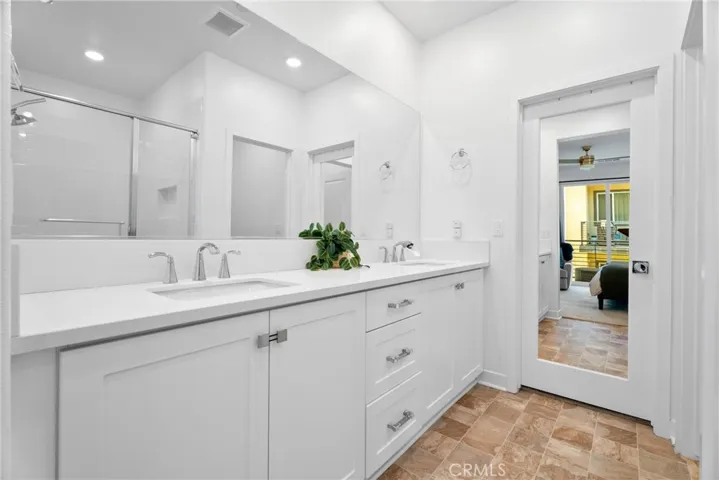 Dual sinks and walk-in shower