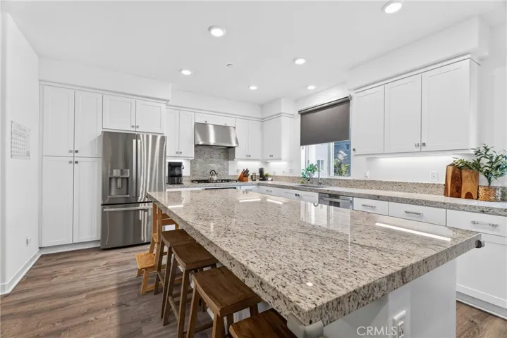 white shaker cabinetry and granite counters