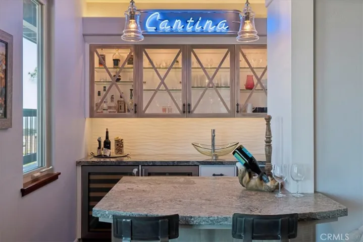 Game room with wet bar or 4th bedroom option.