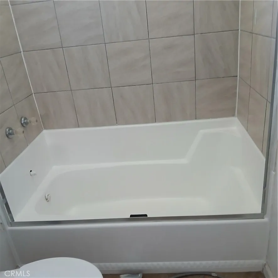 Re-glazed tub in hall bathroom.