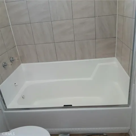 Re-glazed tub in hall bathroom.