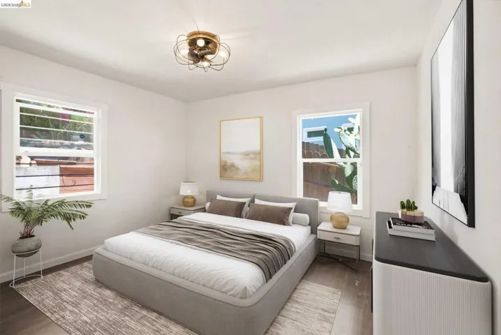 Bright room with wood-finish flooring and white walls