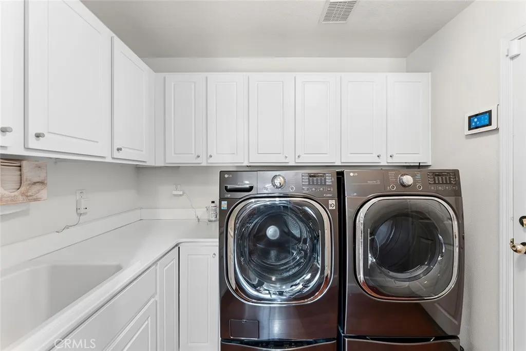 Main floor laundry room with sink