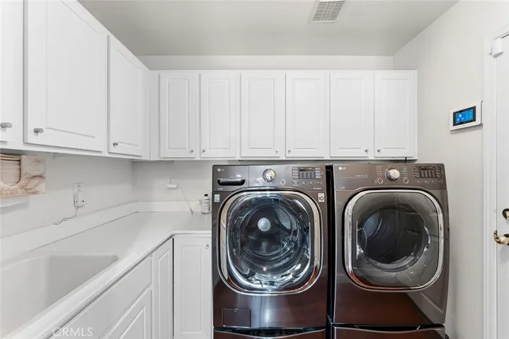 Main floor laundry room with sink