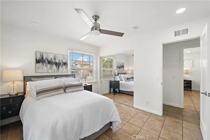 Bedroom #3 has mirrored closet, recessed lighting, ceiling fan