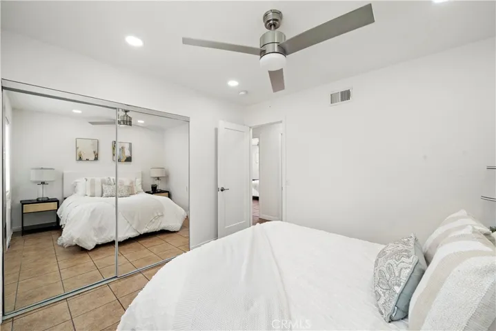 Bedroom #2 has mirrored closet, recessed lighting, ceiling fan