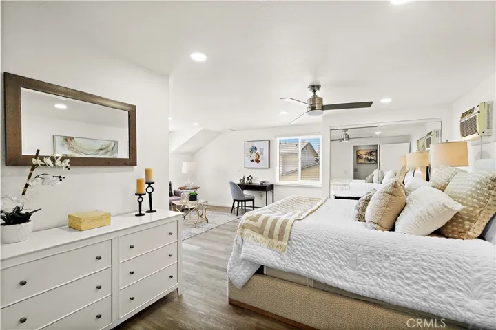 Bedroom #4 Upstairs second primary suite with sitting area, mirrored closet, recessed lighting, ceiling fan, and ensuite bathroom
