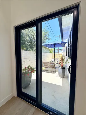 Door off Family/Game/Great room to private side patio