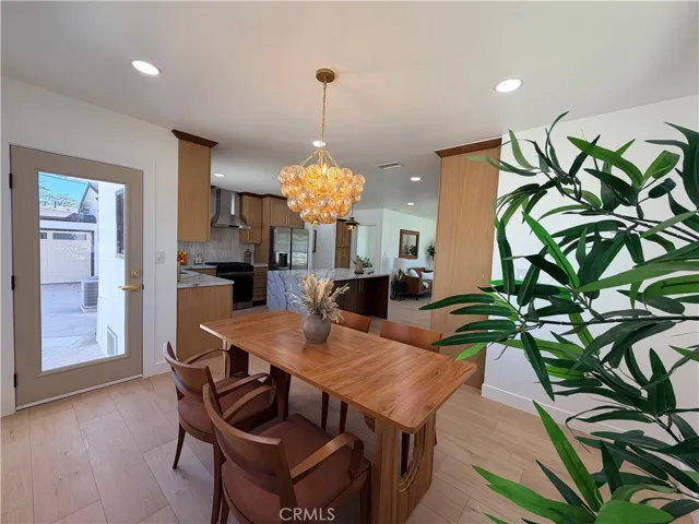 Formal dining room overlooking the prep island with counter seating.
