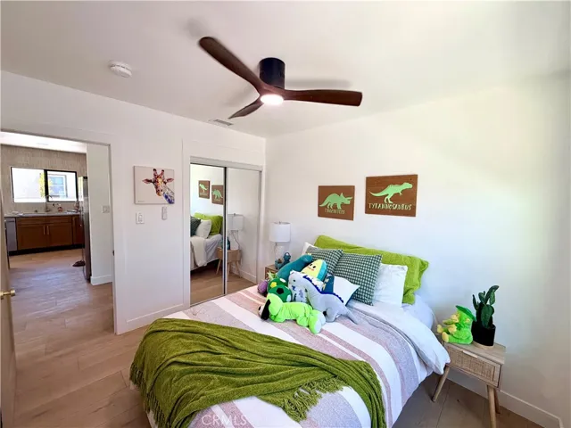 Front/Guest bedroom with mirrored wardrobe closet doors.