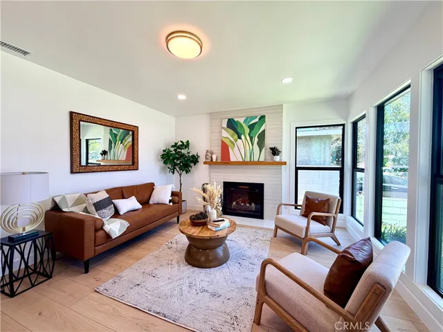 Warmth and love fill this formal Living room, along with tons of natural sunlight.