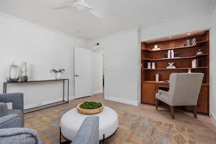 Third bedroom is currently being used as an office/sitting area. The built-in desk can be removed and closet doors can be installed to turn this back into a bedroom