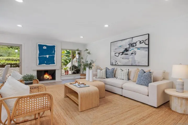 You have a spacious living/dining great room with fireplace plus a separate family room. (Fireplace was digitally altered)