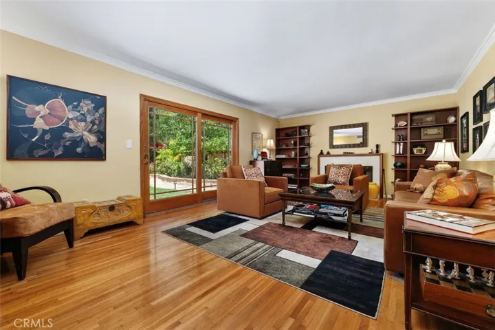 Living Room overlooks the yard, wood flooring
