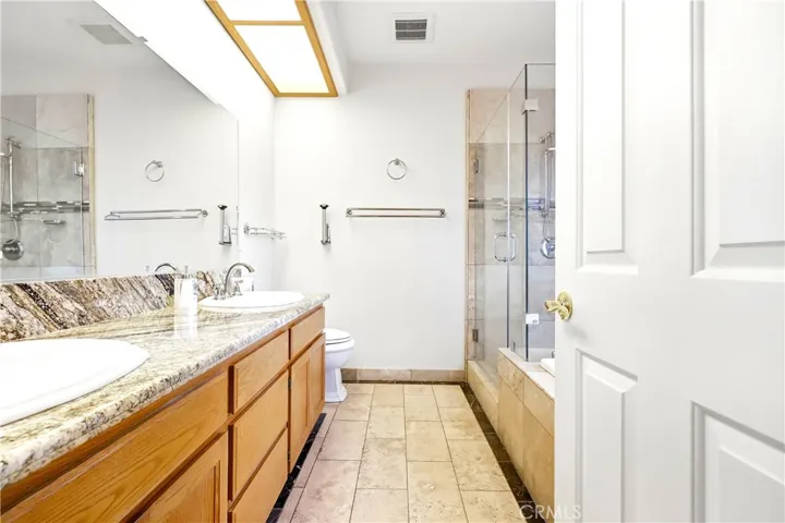 Primary Bathroom - separate shower, jetted tub, and dual sinks