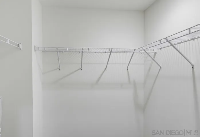 Dual walk-in closets in primary bedroom