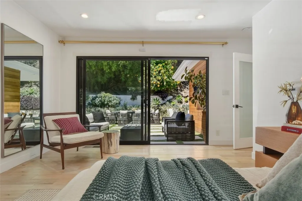 Primary Bedroom Seating Area and Sliding Doors to Backyard