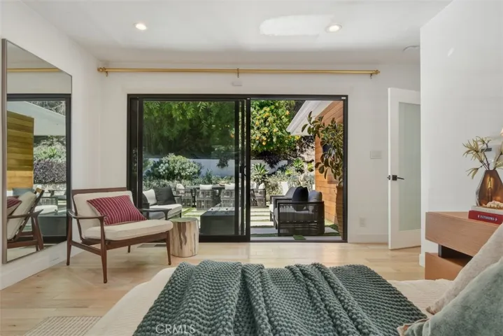 Primary Bedroom Seating Area and Sliding Doors to Backyard