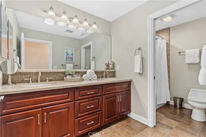 Bathroom #3 (Added Full Bath  & Permitted) ~ new cabinetry, countertop and dual sinks...~