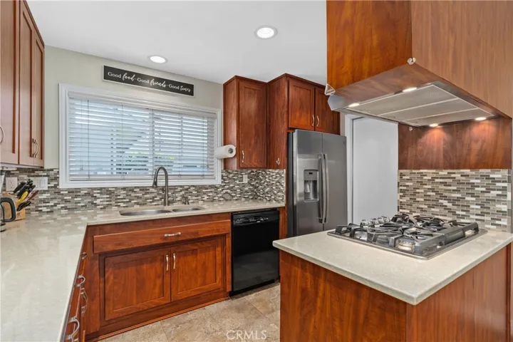 Updated Kitchen with the popular quartz counters and decorator tile~