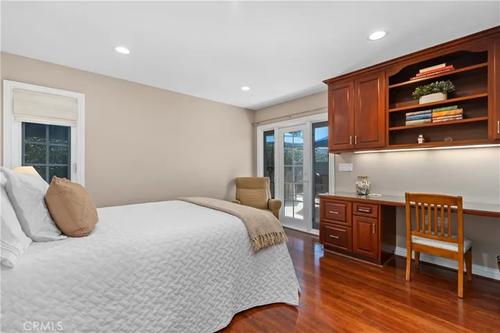 Bedroom #4 features a built-in desk and added French Door to the backyard patio!
