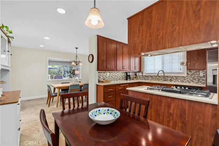 The kitchen is open to the dining room where you can see through to the gorgeous patio area~