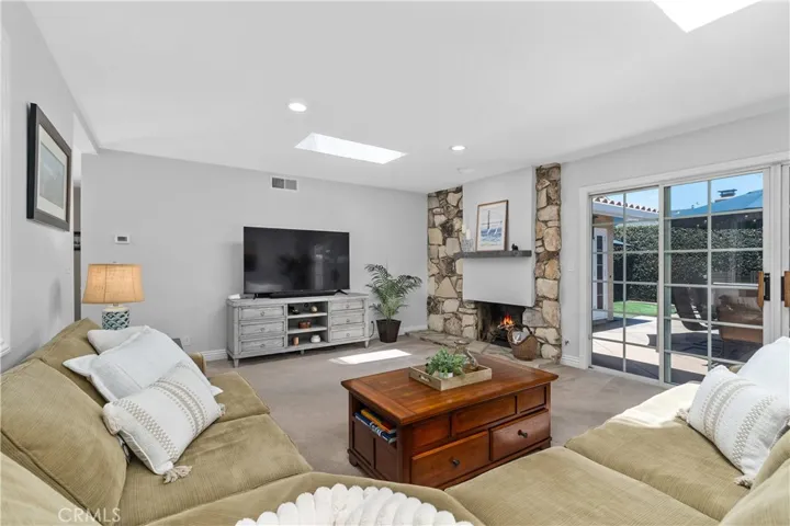 The living room sliding doors open onto the patio area ~ wonderful for "indoor-outdoor" entertaining~