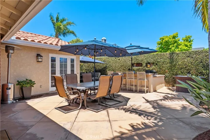 An enchanting backyard with an expansive stained concrete patio~